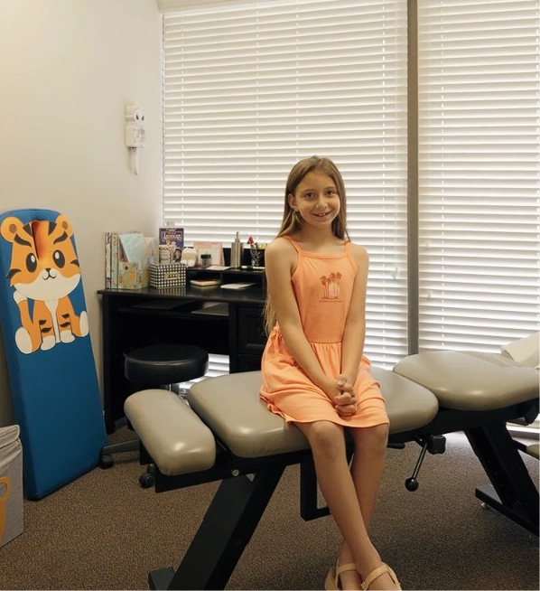 Child in a pediatric chiropractic care room at The Natural Path Health Center
