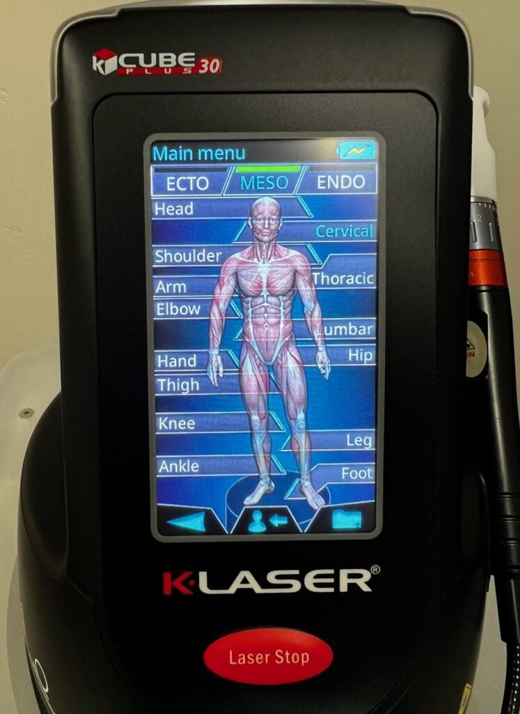 K-Laser K-Cube Plus 30 device touchscreen showing the body region selection menu