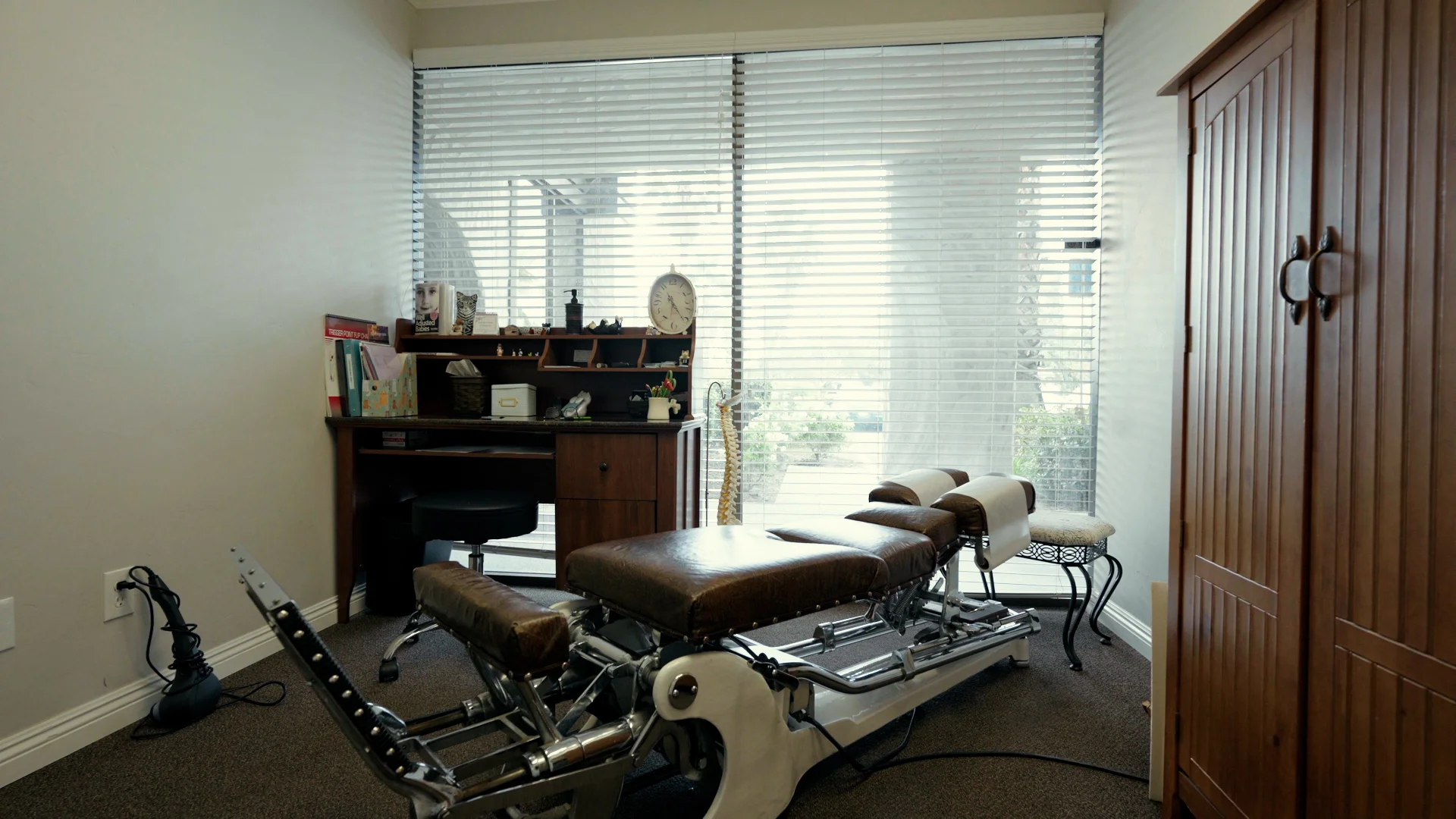Primary chiropractic adjustment room with flexion-distraction table at The Natural Path Health Center in Fresno