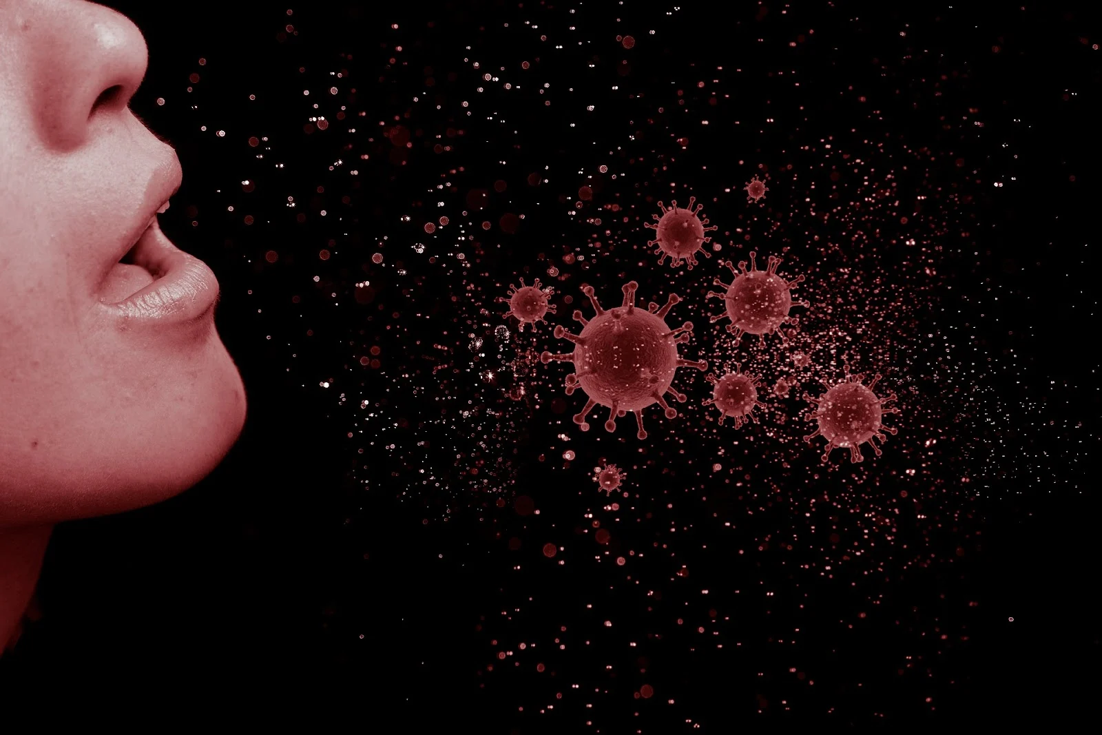 Profile of a face with airborne virus particles representing flu season