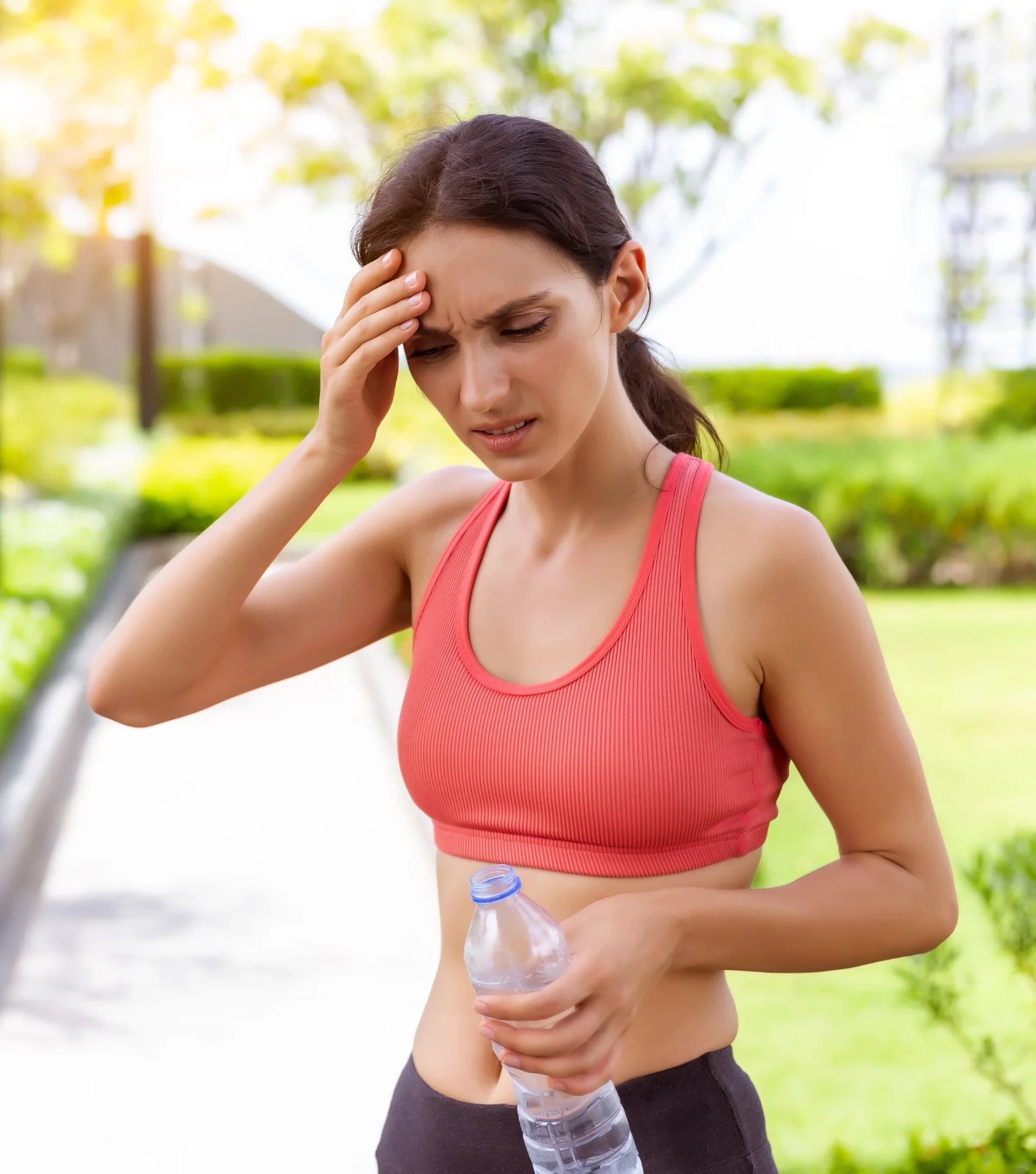 Woman experiencing dizziness and headache — a symptom that may be associated with mold and mycotoxin exposure