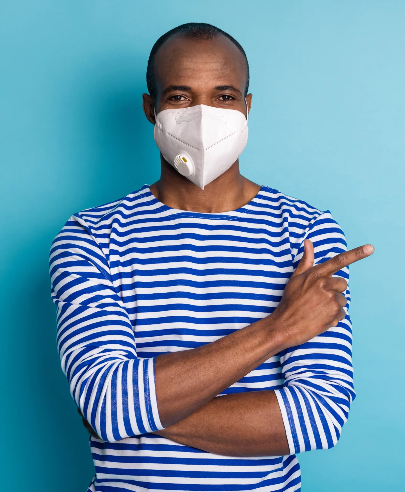 Man wearing a protective mask to reduce exposure to indoor mold and airborne mycotoxins